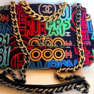 CHANEL Black and Gold Shoulder Bag with Iconic Chain